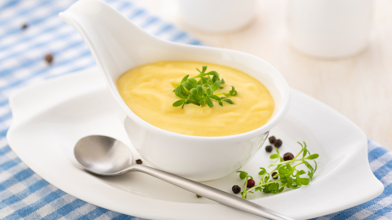 Hollandaise sauce in white dish