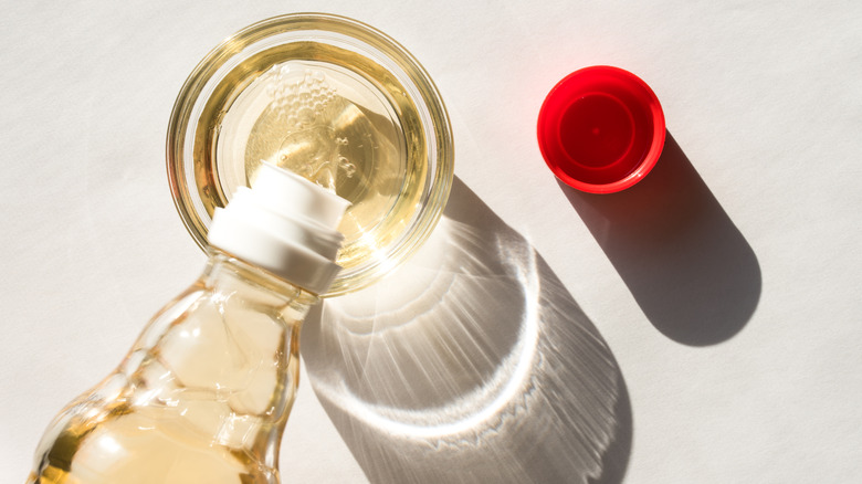 pouring rice wine vinegar in a bowl