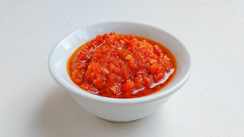 sambal tomat or spicy tomato paste in white bowl