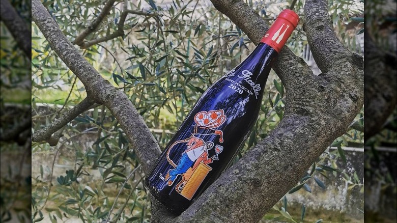 wine bottle on tree trunk