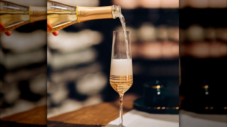 pouring sparkling rose wine 