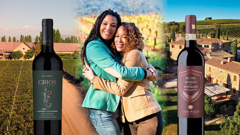 two women hugging between two wine bottles with vineyard backdrops