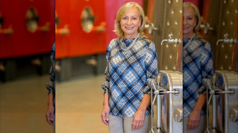 Italian winemaker Marilisa Allegrini standing by a wine tank in a winery