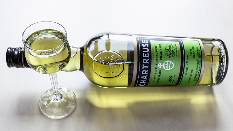 bottle and glass of green Chartreuse