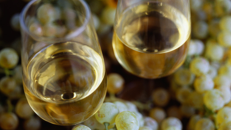 Two glasses of fino sherry and bunches of grapes