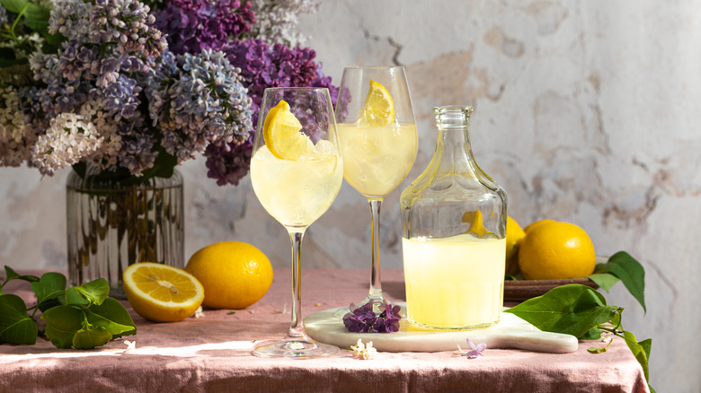 Two limoncello spritzes and bottle of limoncello