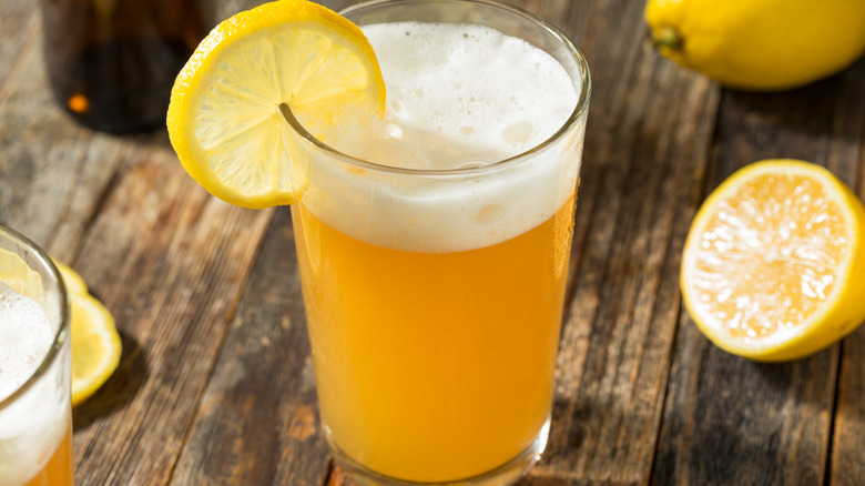 Shandy in glass with lemons