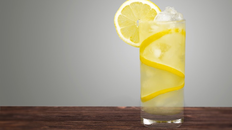 tall lemon cocktail with lemon twist