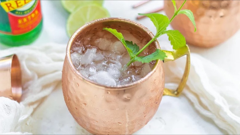 Moscow Mule cocktail in copper mug with mint and lime