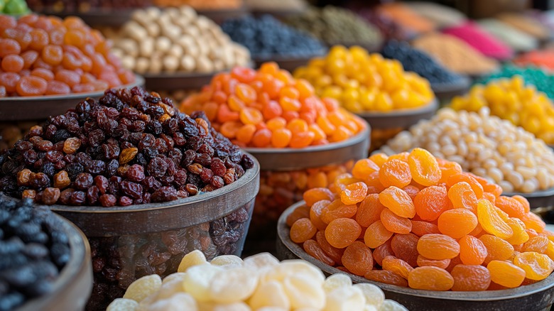 bowls containing different dried fruits