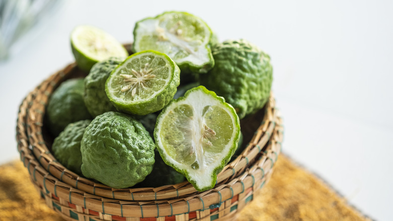 Kaffir limes in woven basked bowl