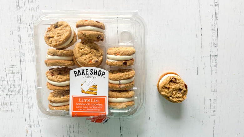 Carrot cake cookies and container on a white board