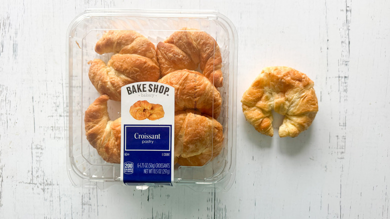 Bake Shop croissants and container on a white board