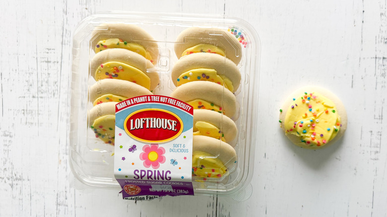 Lofthouse sugar cookies and container on a white board