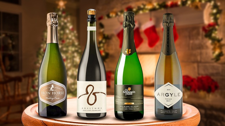 lineup of four sparkling wine bottles