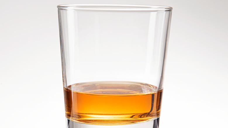 whiskey neat on white background