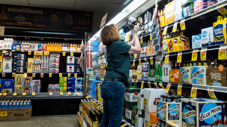 Woman stocking shelves