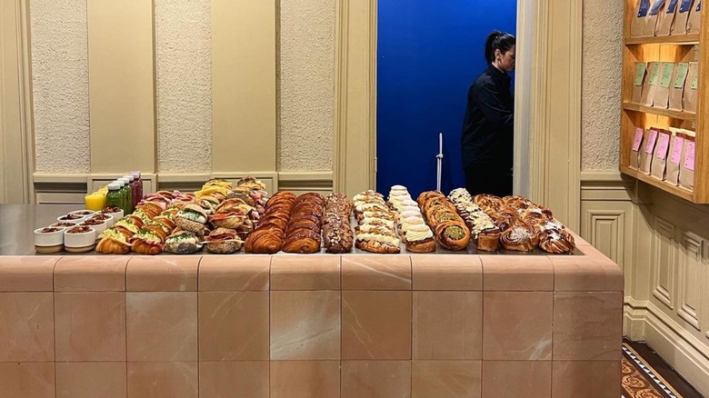 tiled counter full of pastries in store