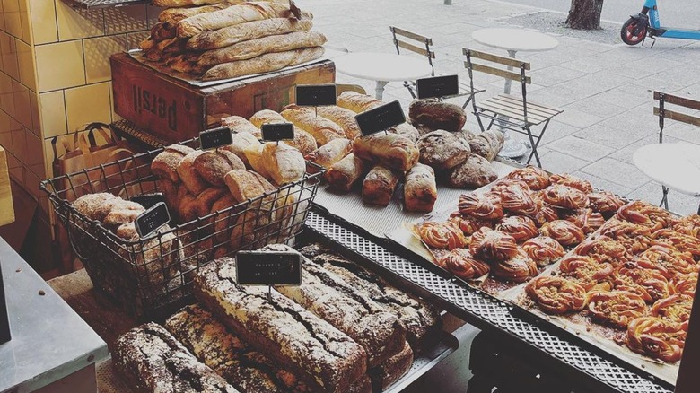 baskets of bread and buns by window