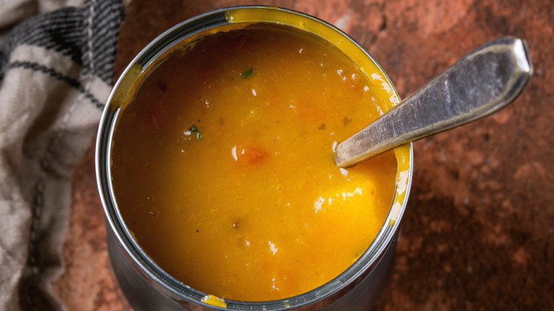 Canned vegetable soup with spoon