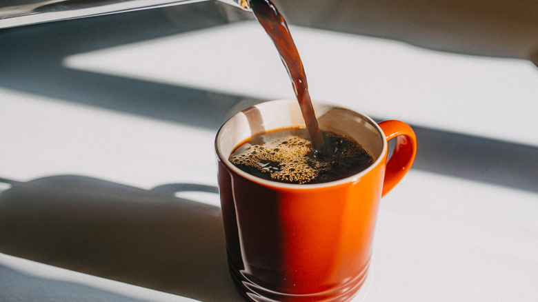 pouring coffee cup