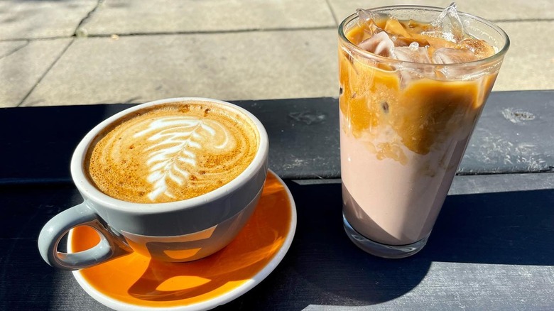 latte and iced coffee on table