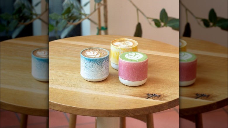 Colorful lattes on table