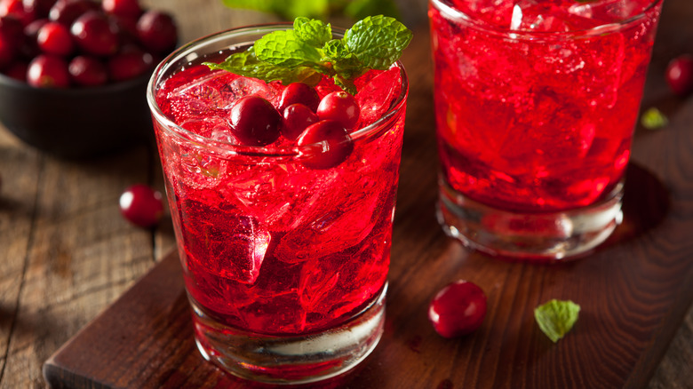 Glasses iced cranberry juice with whole cranberries