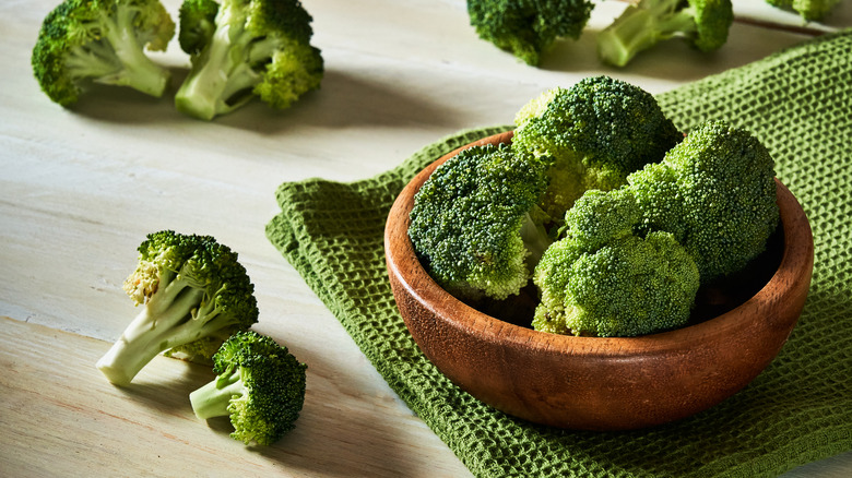 Broccoli florets in wooden bowl