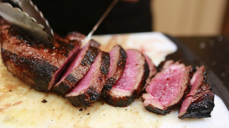 Medium rare steak on plate