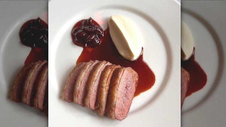 slices of duck with brown sauce