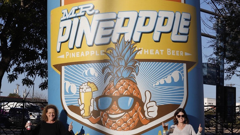 Giant inflatable Mr. Pineapple beer