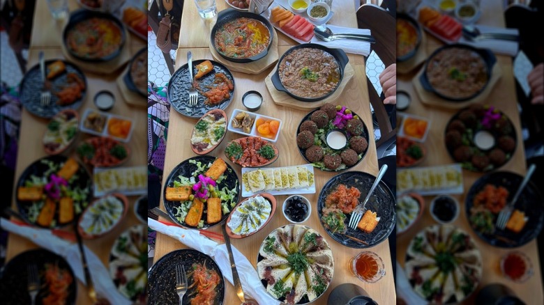 Palestinian food spread, wood table