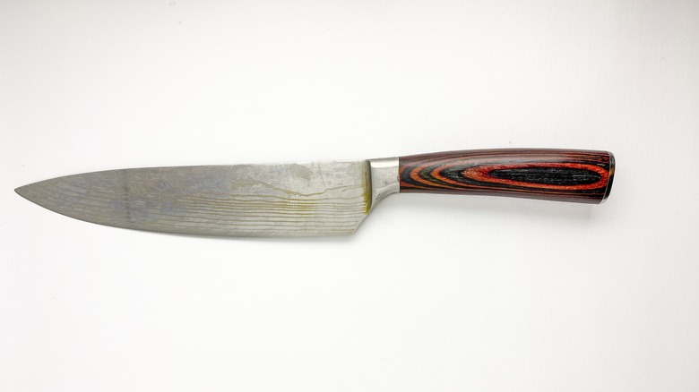 Chef knife with Damascus blade and a partial bolster