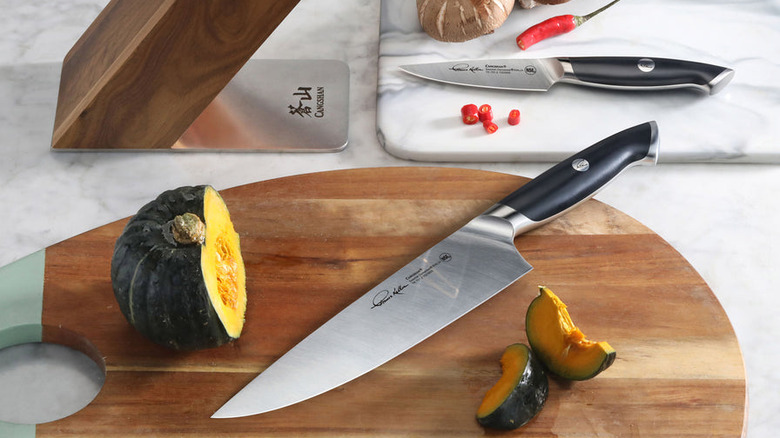 Cangshan Thomas Keller chef knife and paring knife on cutting boards