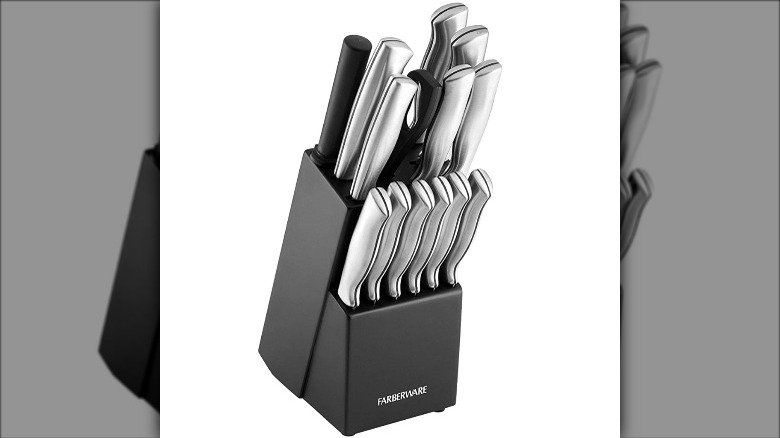 Silver Faberware knife set in a black block