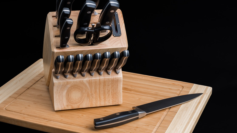 Unbranded wooden knife block on a cutting board