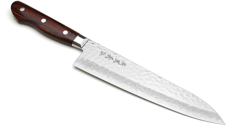 Yoshihiro chef's knife against a white background