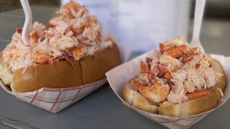 Two lobster rolls with forks