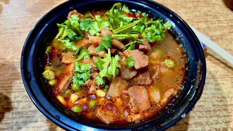 Meat and cilantro in broth