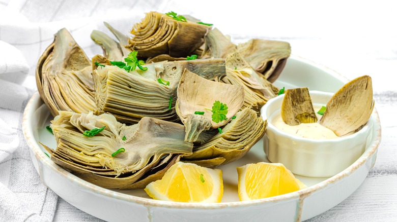 Artichoke hearts on white plate