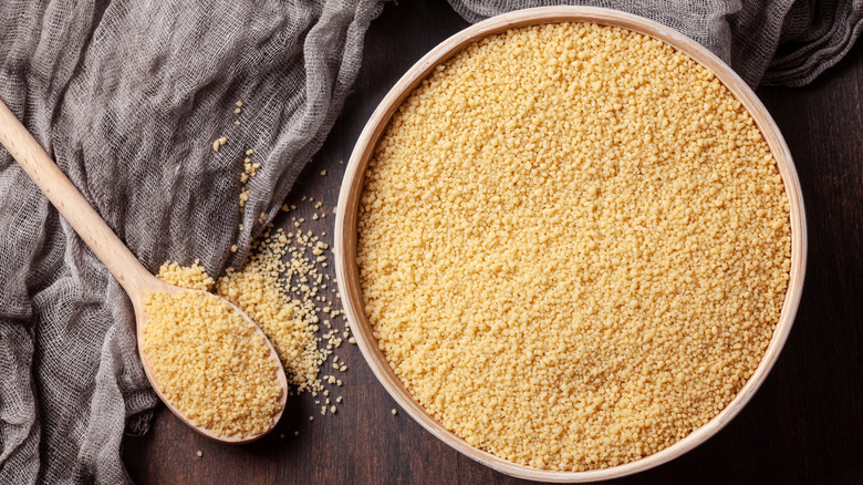 Couscous in wooden bowl