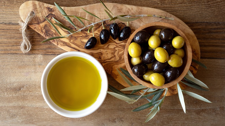 Bowl of olives on board