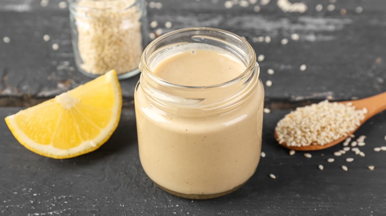 Jar of tahini with lemon