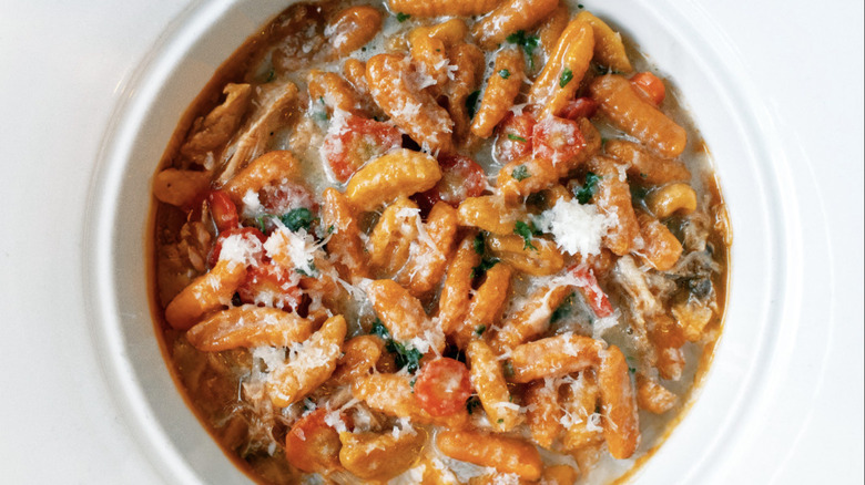 Pasta on plate with red sauce and cheese