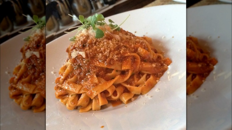 Plate of ragù with toppings