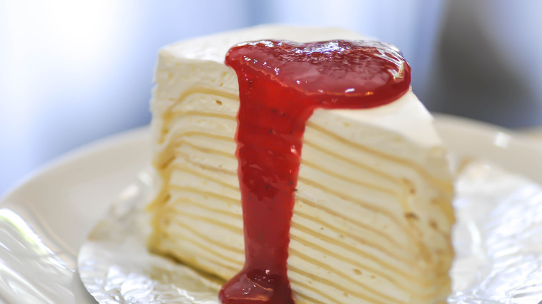 Crepe cake with strawberry sauce