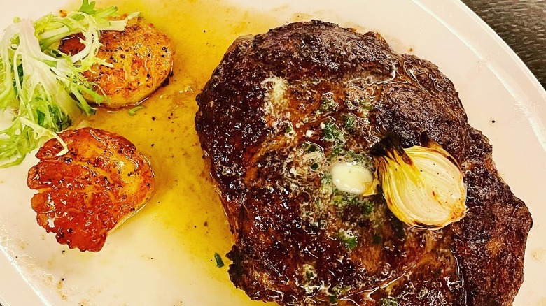 Juicy bone-in ribeye on plate