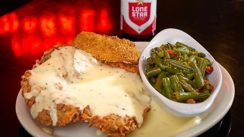 Chicken fried steak with creamy gravy on plate