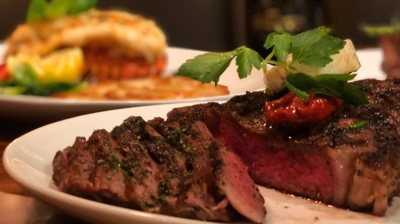 sliced tomahawk ribeye on a plate